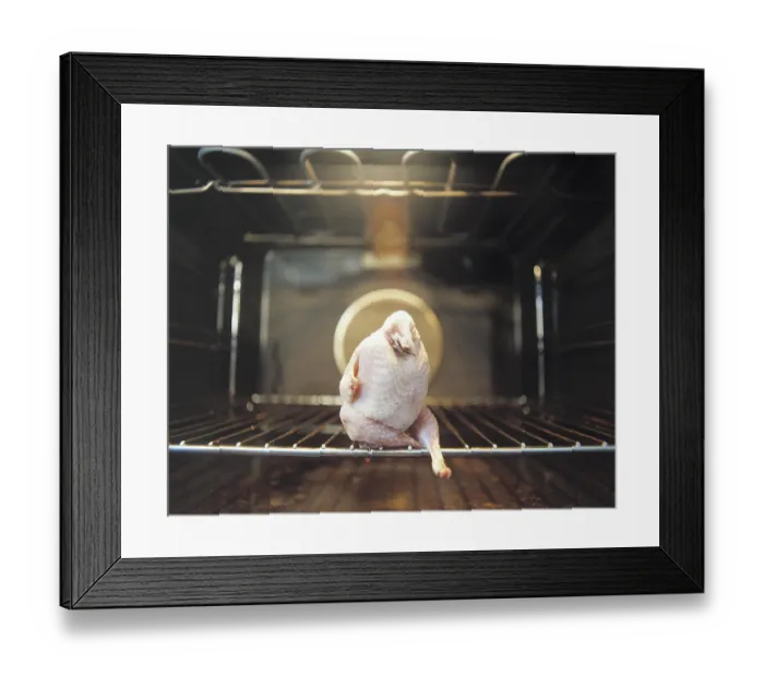 Framed Print : Plucked quail sitting with its legs crossed in a roasting oven