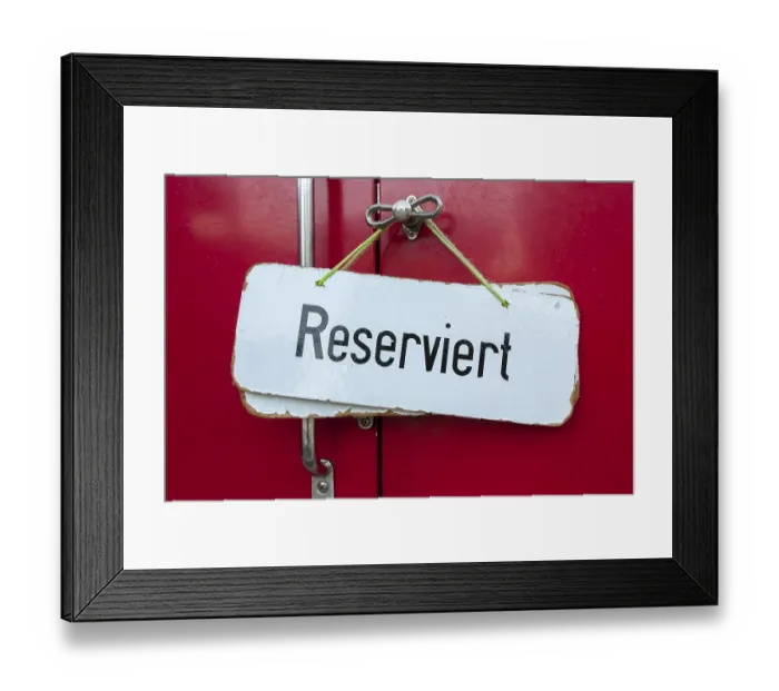 Framed Print : Sign, 'Reserviert', German for 'Reserved' in a train compartment of a historic cog railway Framed Print : Sign, 'Reserviert', German for 'Reserved' in a train compartment of a historic cog railway