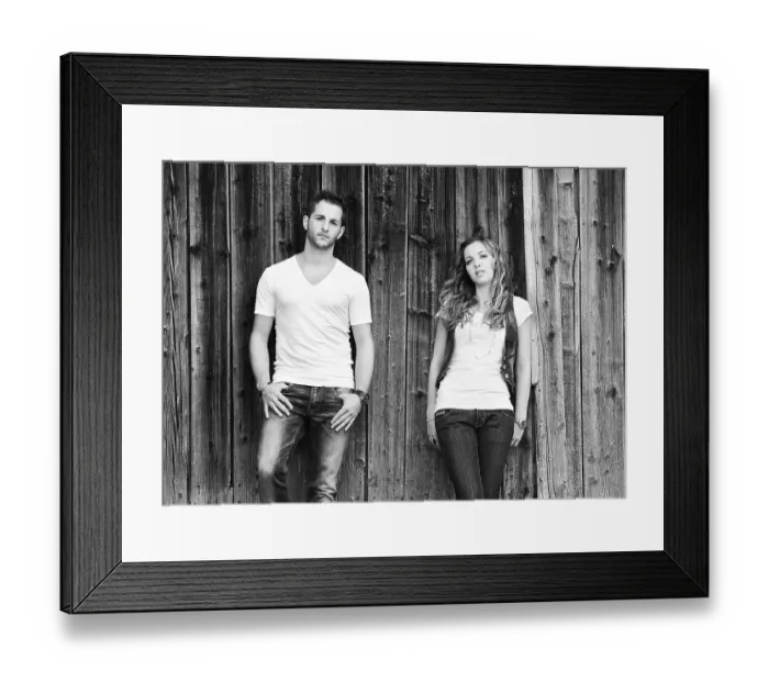 Framed Print : Young man and a young woman leaning against wooden wall Framed Print : Young man and a young woman leaning against wooden wall