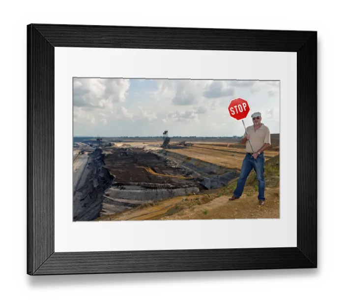 Framed Print : Man standing on the edge of an open pit