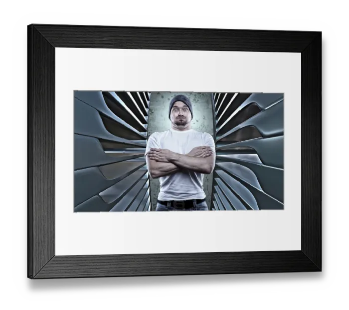 Framed Print : Man posing like a macho with his arms folded Framed Print : Man posing like a macho with his arms folded