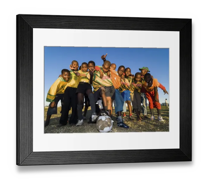 Framed Print : Children with a football, football team