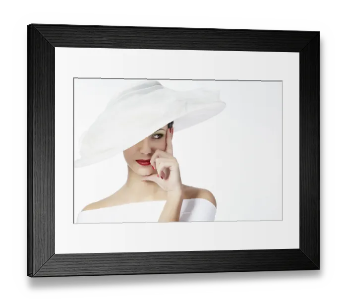 Framed Print : Portrait of a young woman wearing a white summer hat and white dress with her hand resting on her cheek and chin Framed Print : Portrait of a young woman wearing a white summer hat and white dress with her hand resting on her cheek and chin