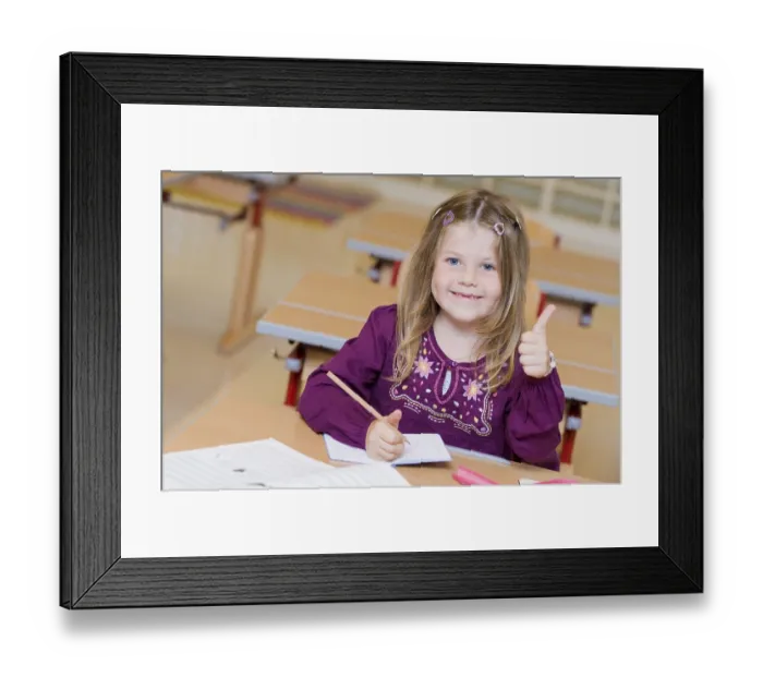 Framed Print : Firstgrader during a lesson
