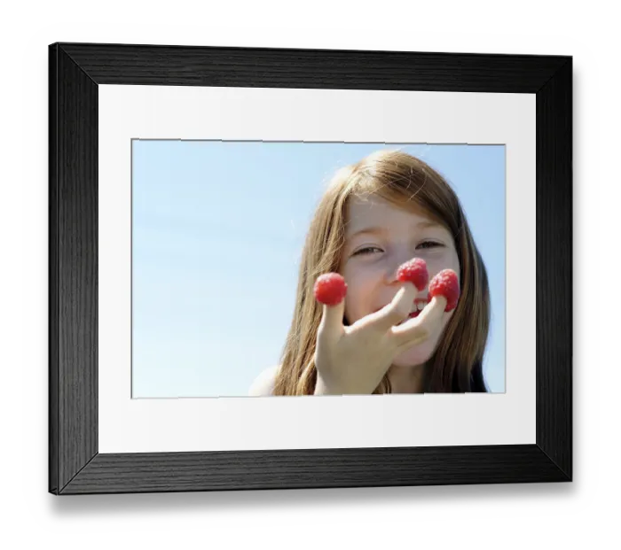 Framed Print : Girl has put her fingers into raspberries Framed Print : Girl has put her fingers into raspberries