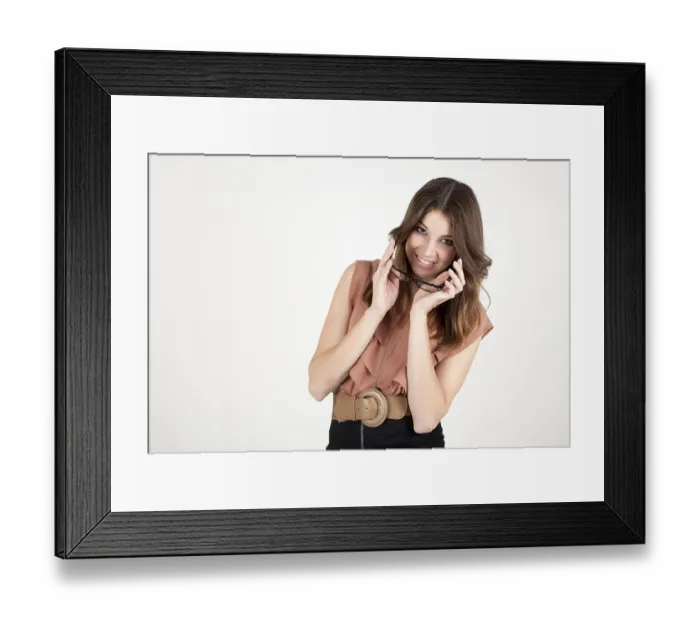 Framed Print : Smiling young woman holding glasses Framed Print : Smiling young woman holding glasses