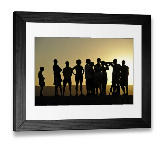 Framed Print : Ranger offering evening view with a telescope and binoculars of sun and stars