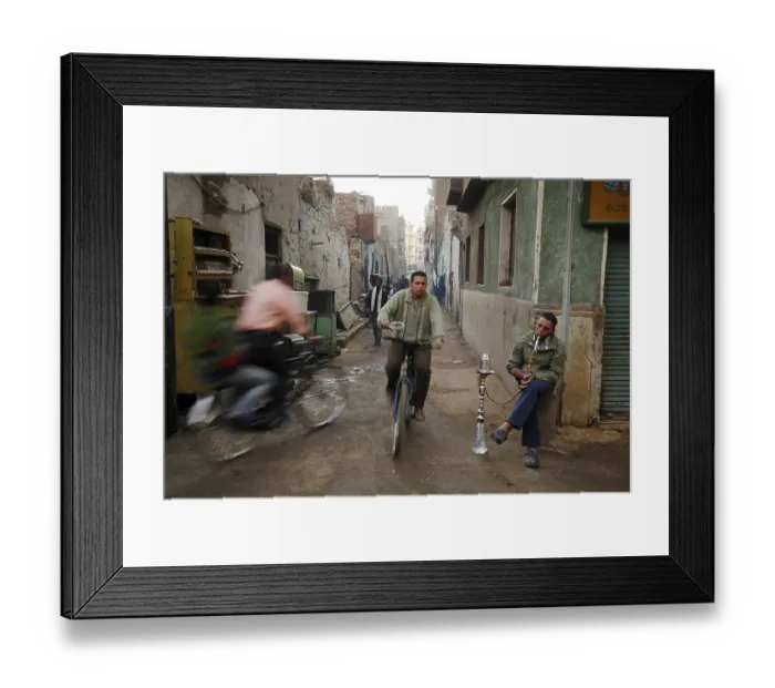 Framed Print : Cyclists and an Egyptian man smoking a water pipe