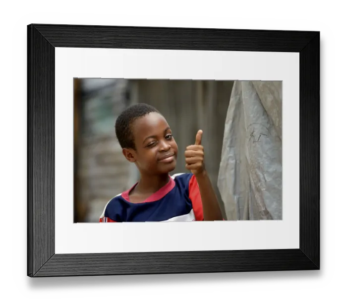 Framed Print : Young winking and giving his thumbs up Framed Print : Young winking and giving his thumbs up