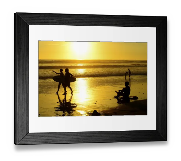 Framed Print : People on the beach with surfboard at sunset Framed Print : People on the beach with surfboard at sunset