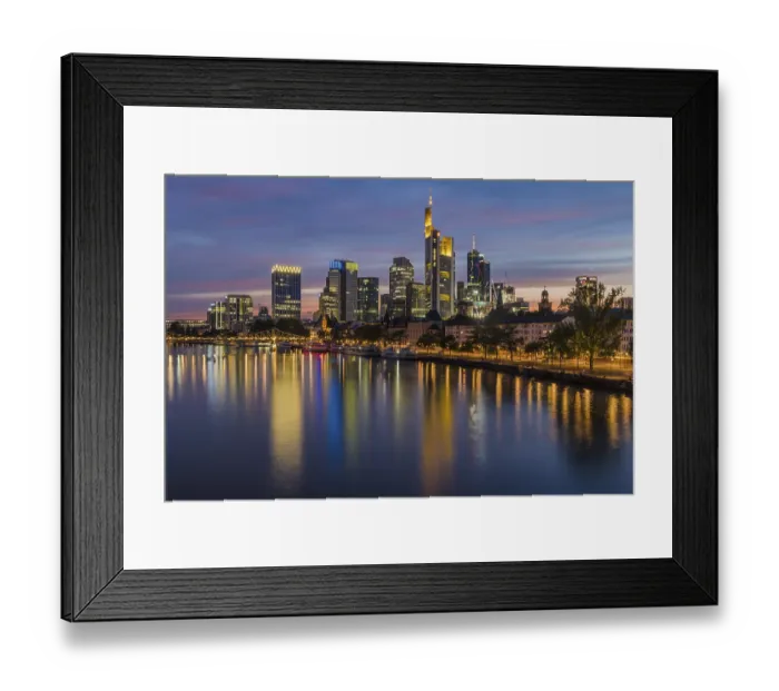 Framed Print : View at blue hour of the colourfully illuminated skyline