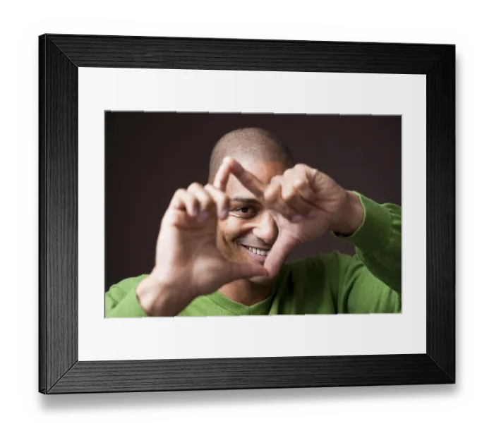 Framed Print : Smiling young man, gesticulating, portrait Framed Print : Smiling young man, gesticulating, portrait
