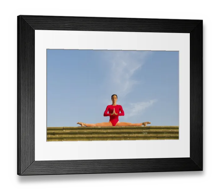 Framed Print : Young woman practising Hatha yoga