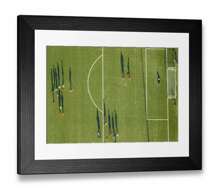 Framed Print : Aerial view, soccer practice, players casting long shadows Framed Print : Aerial view, soccer practice, players casting long shadows