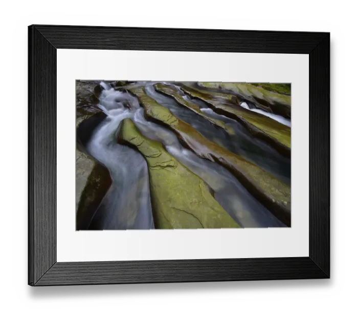 Framed Print : Rock gullies formed by water in the riverbed