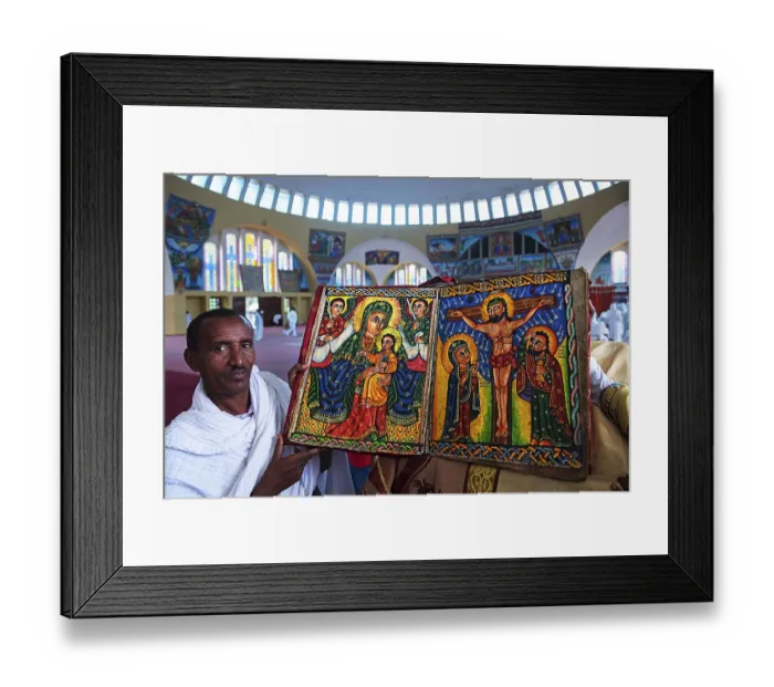 Framed Print : Priest shows hand-painted Bible with Mary and Jesus and Crucifixion Jesus