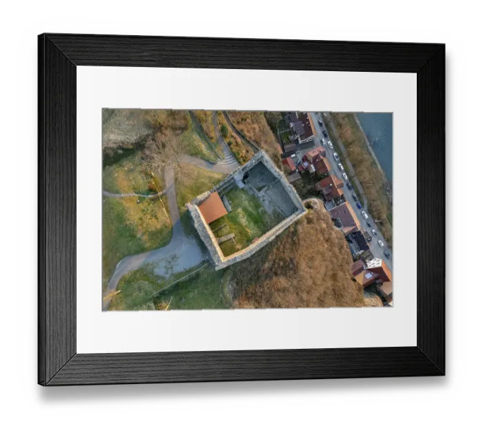 Framed Print : Aerial view of a castle ruins with adjacent streets and houses