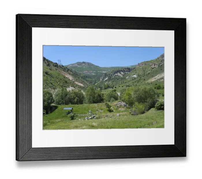 Framed Print : Green valley with trees and surrounding mountains Framed Print : Green valley with trees and surrounding mountains