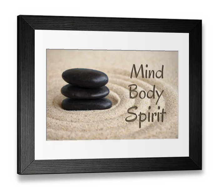 Framed Print : Mind, body and spirit text with black Zen stones on sand background