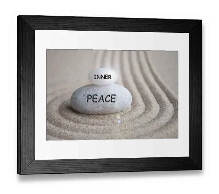 Framed Print : Inner peace text engraved on Zen stone on sand with shining