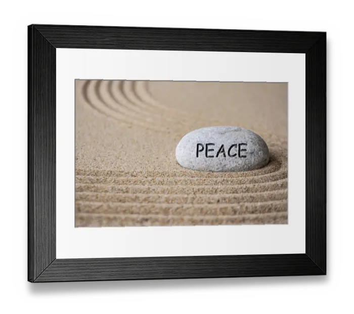 Framed Print : Peace text engraved on Zen stone on sand Framed Print : Peace text engraved on Zen stone on sand
