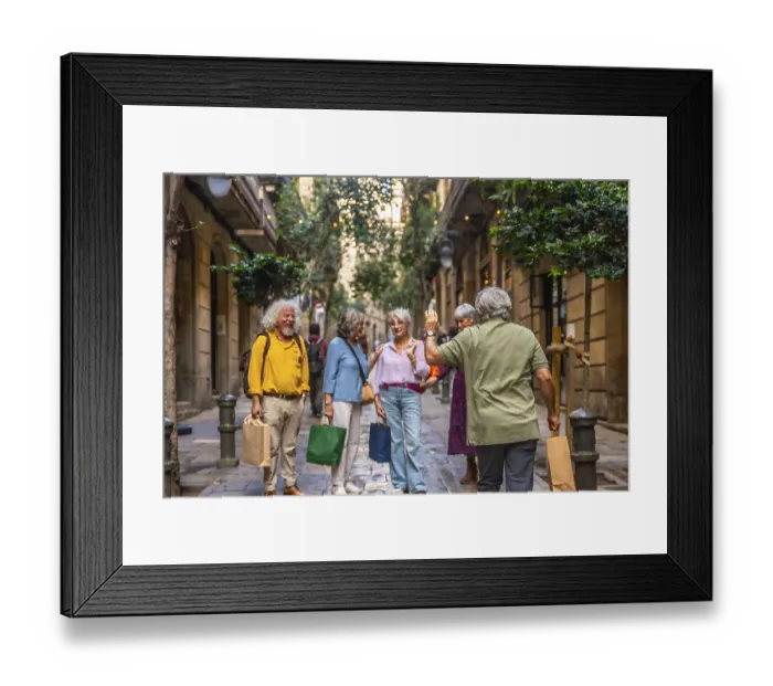 Framed Print : Group of diverse senior friends meeting and greeting on a charming narrow urban street
