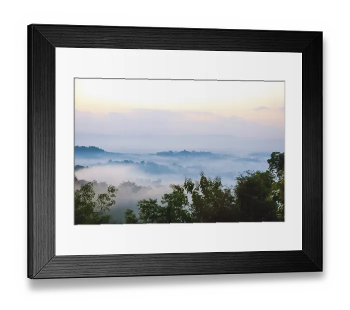Framed Print : Colorful sunrise over jungle with Merapi volcano behind and Borobudur temple Framed Print : Colorful sunrise over jungle with Merapi volcano behind and Borobudur temple