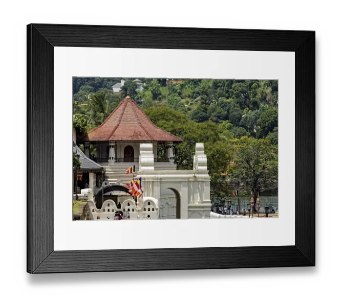 Framed Print : A temple with a pavilion surrounded by colorful flags and a river in the background