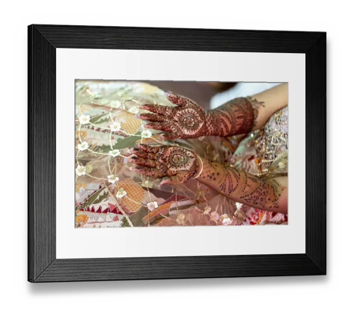 Framed Print : Intricate henna designs adorn the hands of a bride