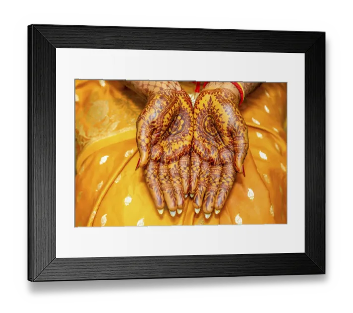 Framed Print : The detailed henna art on the hands is a beautiful display of cultural heritage and artistic skill