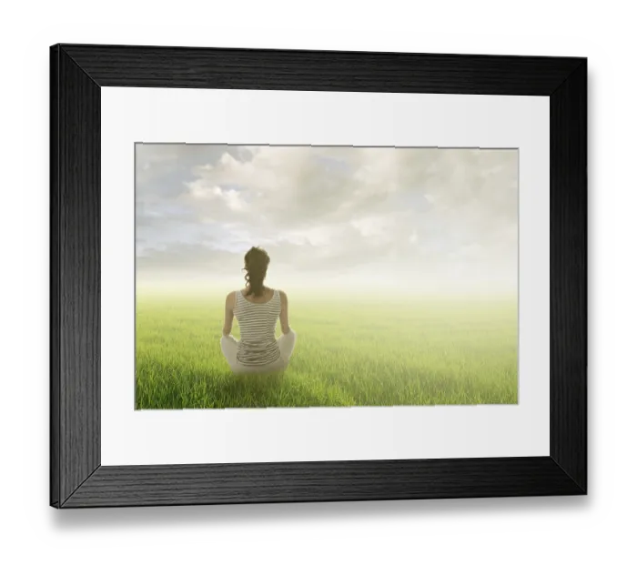 Framed Print : Woman of brunet hair sit on grassland against sunrise or sunset