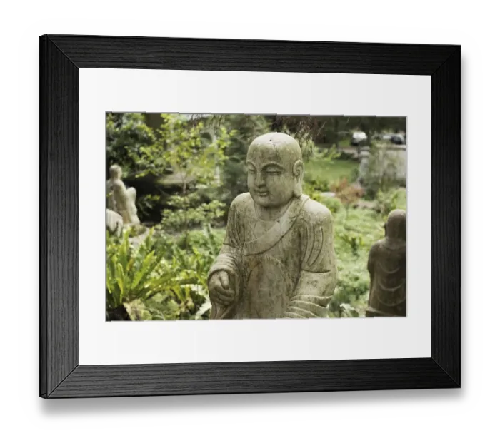 Framed Print : Ruined stone statue Ksitigarbha Bodhisattva in garden