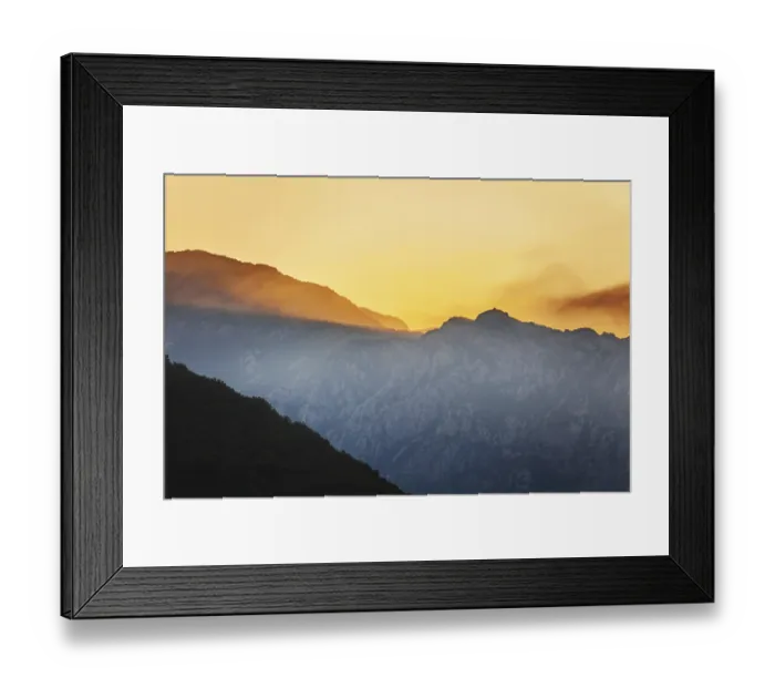 Framed Print : Mountain sunset and colored sky with clouds