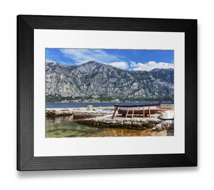 Framed Print : The old boat at the beach in the morning with the sea and mountains
