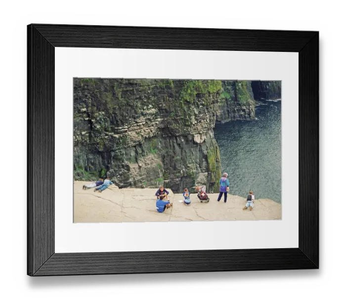 Framed Print : People on the cliff edge, there was no fence back then