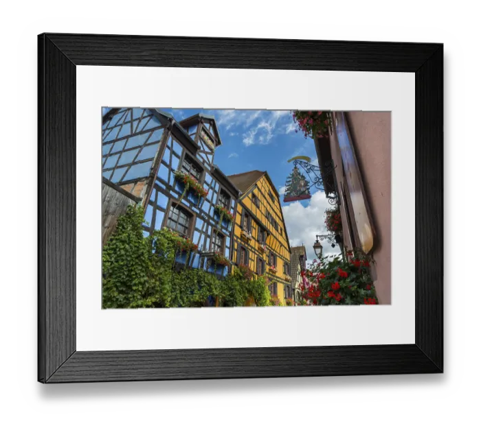Framed Print : Decorated half-timbered houses in the historic old town of Riquewihr Framed Print : Decorated half-timbered houses in the historic old town of Riquewihr