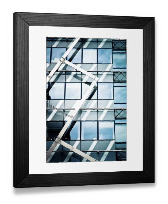 Framed Print : Modern glass building with geometric metal framework and reflections