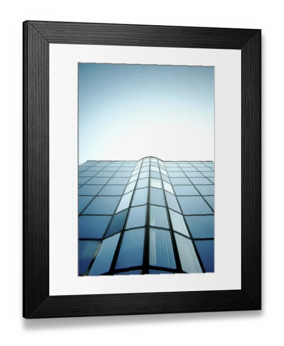 Framed Print : Symmetrical glass building with reflective surface and blue sky Framed Print : Symmetrical glass building with reflective surface and blue sky