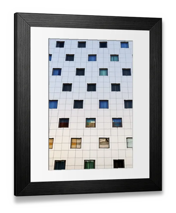 Framed Print : Modern building facade with a grid of square windows in various colors Framed Print : Modern building facade with a grid of square windows in various colors