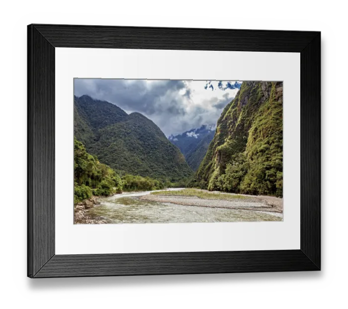 Framed Print : Winding river path through a lush green valley