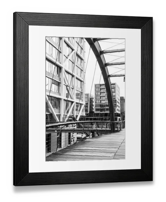Framed Print : The contrast between the modern bridge and the historic urban environment Framed Print : The contrast between the modern bridge and the historic urban environment