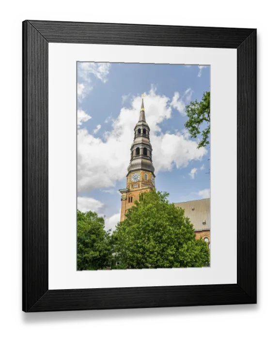 Framed Print : Tower of the historic St. Catherine's Church under a blue sky in Hamburg Tower of the historic St
