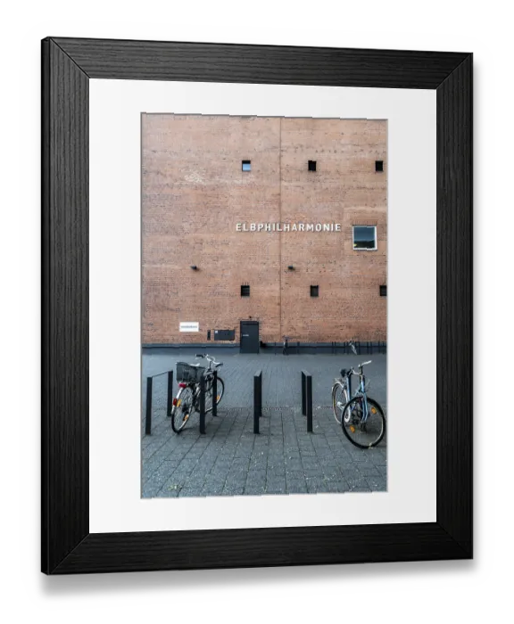 Framed Print : Bicycles parked in front of the brick facade of the Elbphilharmonie in Hamburg Framed Print : Bicycles parked in front of the brick facade of the Elbphilharmonie in Hamburg