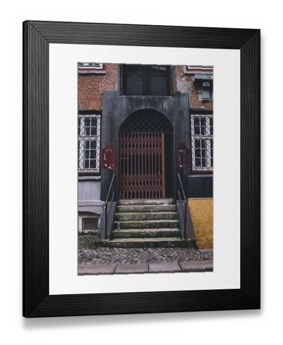 Framed Print : Old stone steps leading to an arched doorway with a red security gate in Hamburg Framed Print : Old stone steps leading to an arched doorway with a red security gate in Hamburg