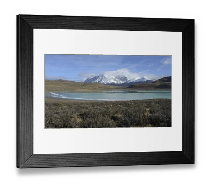 Framed Print : Serene lake reflecting snowy mountains under a clear blue sky