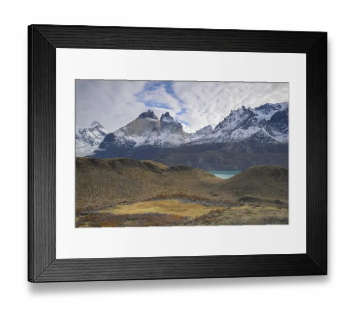 Framed Print : Expansive landscape view with snowy mountains and rolling hills