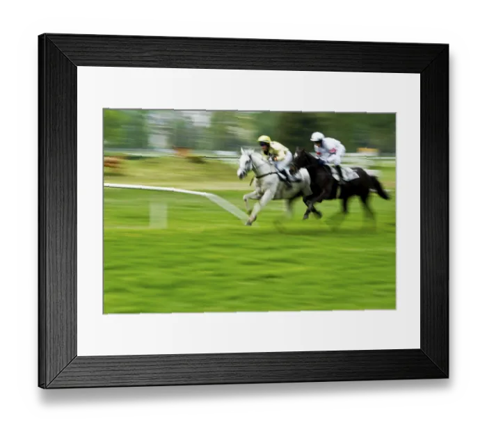 Framed Print : Two jockeys racing on a grassy field