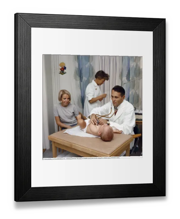 Framed Print : In 1969 Sweden, a doctor examines a child at a child health centre Framed Print : In 1969 Sweden, a doctor examines a child at a child health centre