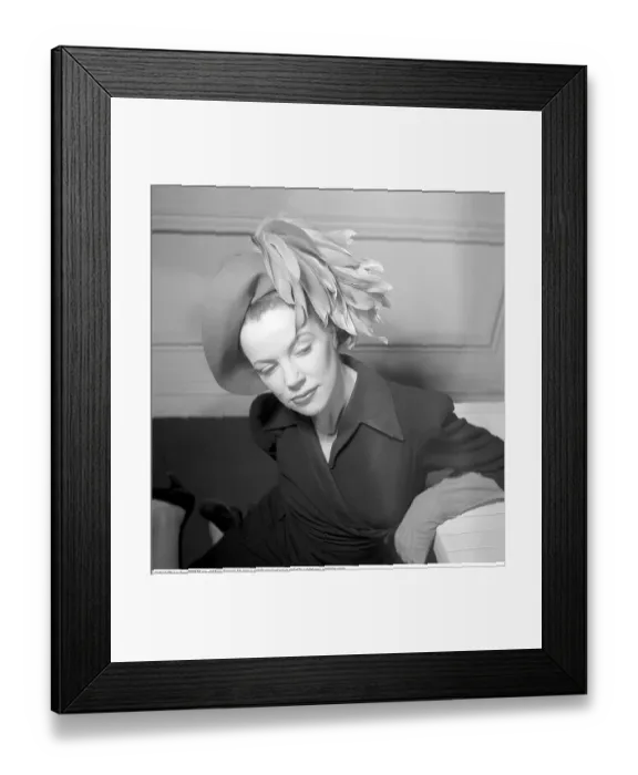Framed Print : England 1945. A fashionable young woman wearing a creative hat and decoration Framed Print : England 1945. A fashionable young woman wearing a creative hat and decoration