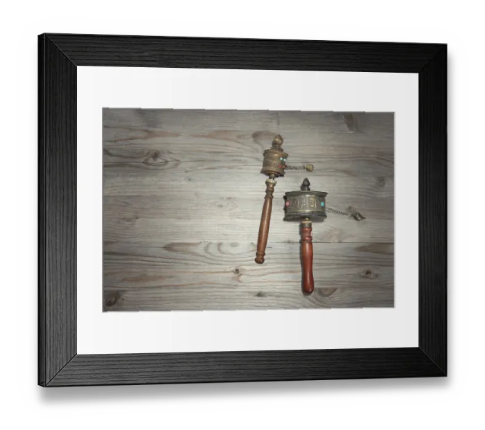 Framed Print : Tibetan prayer wheel or mani wheel on old wooden background with copy space Framed Print : Tibetan prayer wheel or mani wheel on old wooden background with copy space